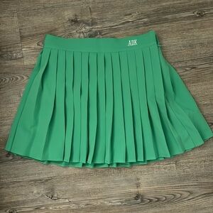 New green pleated skirt